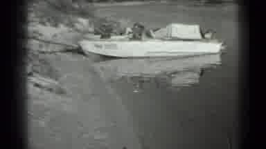 Moscow Russia (1983): Older Caucasian Woman Fishes From Shore While An Aluminum