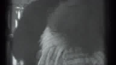 Moscow Russia (1983): Man Wearing Black Coat Hugs Woman Wearing Grey Coat