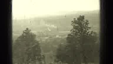 Bend Oregon (1937): Footage Of A Metal Plaque And Then A View Of A Forest From On