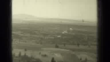 Bend Oregon (1937): Aerial View Of Farmland And Trees On A Cloudy Day