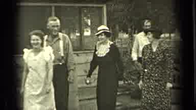 Bend Oregon-1937: A Group Of People Walking Outside With Animals