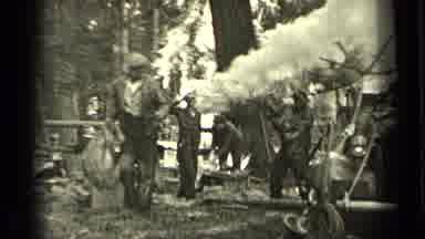 Bend Oregon (1937): Man Carrying Sack Walks Away From Large Fire With Dog On A