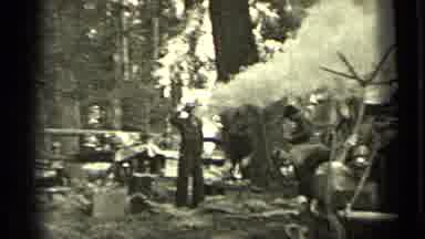 Bend Oregon (1937): People In The Woods One Man Chopping Wood And Smoke Billowing
