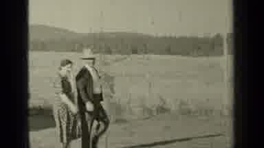 Bend Oregon (1937): Man And Woman Walking To Truck