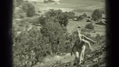 Klamath California (1937): Two Kids Running Up Hill In A Colorless Video