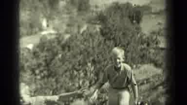 Klamath California (1937): Two Smiling Fair-Haired Youngsters Climbing Up A Hill