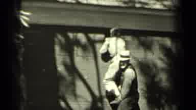 Klamath California (1937): A Man Assisting Another Person To Look Inside A