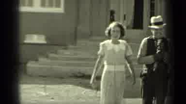 Klamath California (1937): Smiling Man Walks Away From A Broken Window With Two