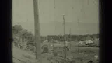 Klamath California (1937): View Of Grey Car Traveling Down Dirt Road On A Sunny