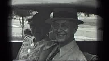 Long Lake Canada (1939): Elder Man And Woman Smile At The Camera In The Car Then