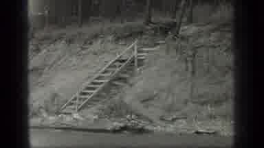 Long Lake Canada (1939): Old Wooden Stairs By The River And A Building By Some