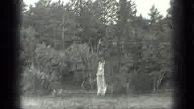 Long Lake Canada (1939): View Of Wooden Object And White Boat On River On A Sunny