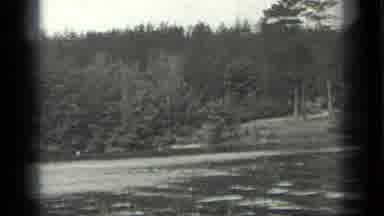Long Lake Canada (1939): Black And White Film Of Trees Around A Rippling Lake