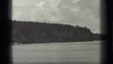 Long Lake Canada (1939): View Of A Lake With Some Trees