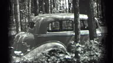 Long Lake Canada (1939): A Car Parks In The Forest And A Sign On A Tree That Says