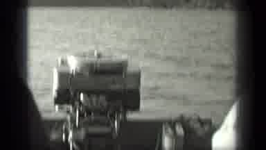Long Lake Canada (1939): View Of Tree And Outboard Boat Motor On A Sunny Day