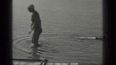 Long Lake Canada (1939): Person Swimming In Water Wearing A Bathing Suit And Swim
