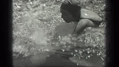 Long Lake Canada (1939): A Man And Woman Vigorously Swim In Swim Caps And Suits