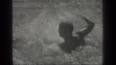 Long Lake Canada (1939): Two Boys Splash Each Other In The Water And Swim Around