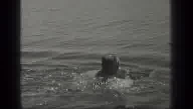 Long Lake Canada (1939): Person Swimming Towards Wood On The Water