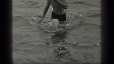 Long Lake Canada (1939): A Man Wearing Shorts Wades Toward Shore Before Turning