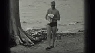 Long Lake Canada (1939): Person Drying Himself As He Gets Out Of The Water Then