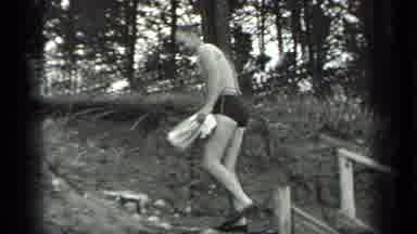 Long Lake Canada (1939): Black And White Video Of Man Skipping Rocks In A River By