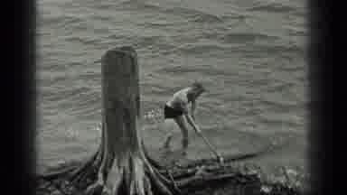 Long Lake Canada (1939): Man Using A Axe To Cut Off A Large Piece Of Old Drift