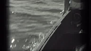 Long Lake Canada (1939): Man In Swimsuit Sits At Bow Of Small Boat Moving Through