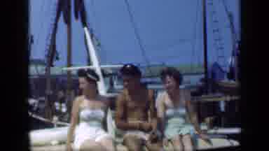Long Island New York (1948): Two Women And A Man Sit On The Back Of A Boat Smiling