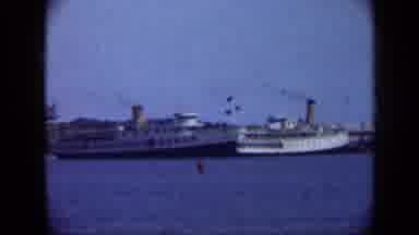 Long Island New York (1948): Distant Ships In Blue Water With Active Smokestacks