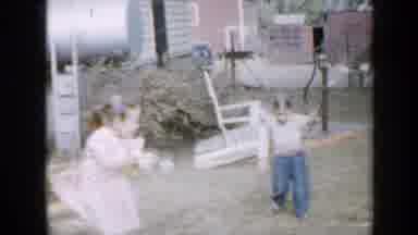 Minnesota USA (1958): Dogs Watching Two Little Girls Play With Hula Hoops