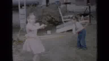 Minnesota USA (1958): Two Kids Playing With Hula Hoops Going Really Fast