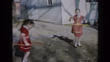Minnesota USA (1958): Two Girls Compete At Spinning Their Hula Hoops Until Girl On