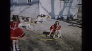 Minnesota USA (1958): Two Young Girls Wearing Matching Red Dresses Playing With
