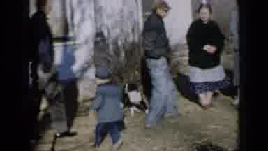 Minnesota USA (1958): Little Kid Running Around Playing With Dog As People Watch