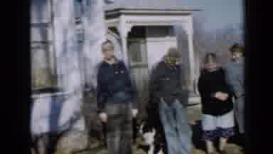 Minnesota USA (1958): Toddler Dashes Across Yard Waits Turns And Heads Off In