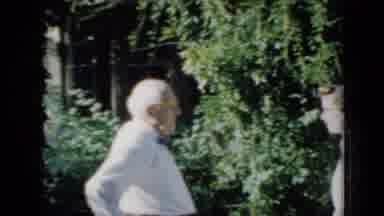 Minnesota USA (1958): Older Man In Bow Tie Is With Young Lady In Sweater Near