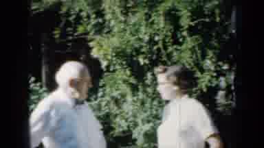 Minnesota USA (1958): Elderly Couple Posing In Front Of A Brick House With A