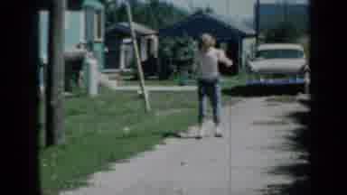 Minnesota USA (1958): Teenage Girl Hula Hoops For Fun In Her Driveway In Front Of