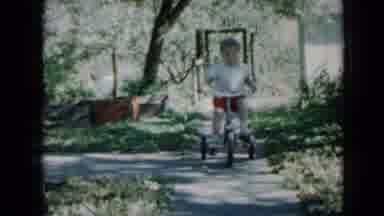 Minnesota USA-1958: A Little Girl Excited About Riding Her Tricycle On The