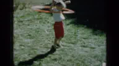 Minnesota USA (1958): A Little Girl Playing With A Toy Called A "Hula Hoop"