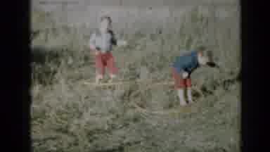 Minnesota USA (1958): Two Kids Having Fun Hula Hooping In The Yard
