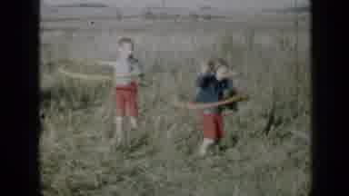 Minnesota USA (1958): Young Children Hula Hooping Child Walking Down Path Elderly