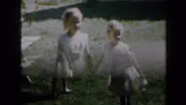 Minnesota USA (1958): Two Blonde Girls Dressed In Yellow Dresses Walk In A