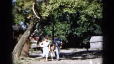 Minnesota USA (1958): A Man A Women And A Little Girl Walking All In Pale Colors