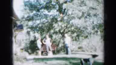 Minnesota USA (1958): Friends And Family Enjoying A Backyard Party With Their Dogs