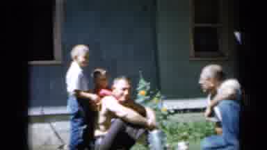 Minnesota USA (1958): Small Children Playing With Their Dad And Grandpa In A