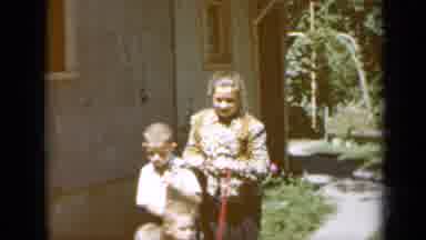 Minnesota USA (1958): Family Going For A Walk Outside Their Home On A Sunny And