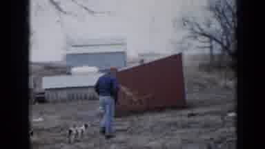 Minnesota USA (1958): Man Leads Three Little Dogs Then Returns Holding Big Dog And